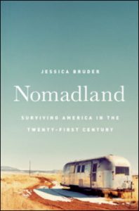 Nomadland title and an RV in the desert