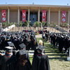 From CSUN's commencement, graduates in front of the library