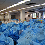 A Sea of Blue Plastic -- Getting Ready to Unpack our Furniture