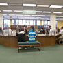 Students getting research help at the old reference desk.