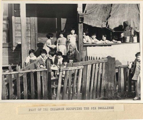 Photograph of children and elder from Poor Housing Conditions in Los Angeles
