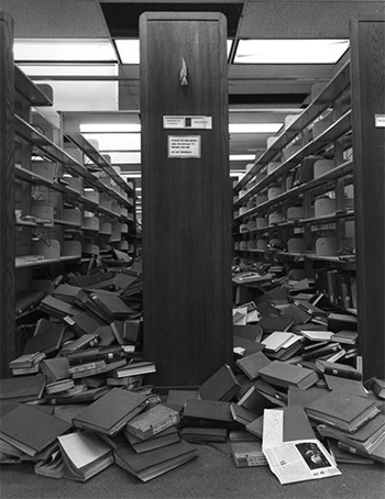Photograph of earthquake damage to the fourth-floor bound-periodicals section of the Delmar T. Oviatt Library at California State University, Northridge (CSUN).