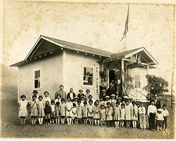 A large group of children are photographed outside of the Palos Verdes Langauge School and Portuguese Bend Community Center.