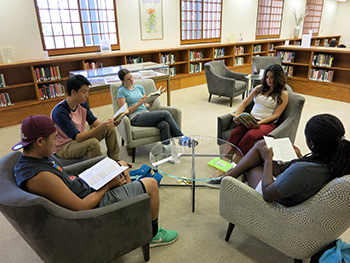 Students using the Gohstand Reading Room at the Oviatt Library