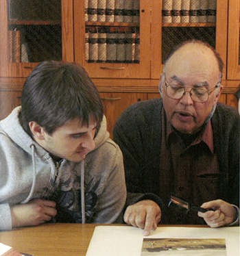 Tony Gardner in Special Collections with a student.