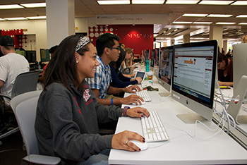Students using the computer stations in the Oviatt Library Learning Commons