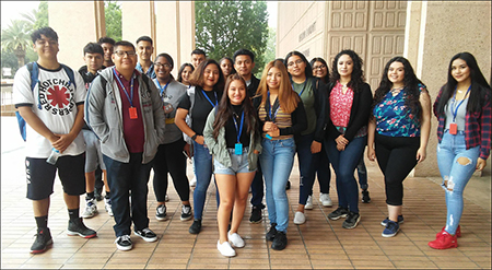 EOP Bridge Students smiling in front of Library