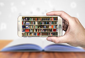 Person holding smartphone with an image of books