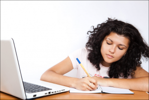 girl studying at laptop