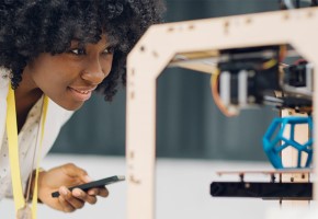 young woman monitoring 3D printing