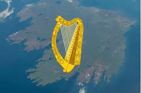 image of Ireland's golden harp national emblem floating over satellite photography of the island of Ireland