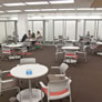 Moveable study desks and chairs, our new glass walled group study rooms, and on the left a whiteboard wall.