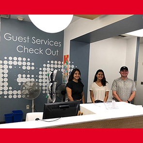 Student workers at the Guest Services desk at CSUN's University Library