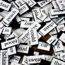 A pile of fridge magnet poetry words