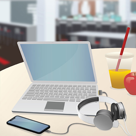 Laptop with headphones and phone attached