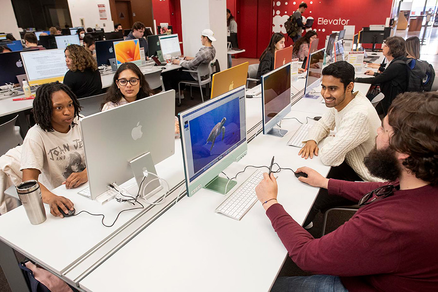 Students at desktop computer tables