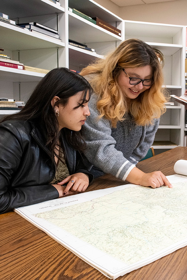 Students in the CSUN University Library Map Collection browsing the collection