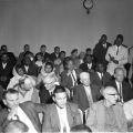 Malcolm X seated in the courtroom audience, Harry Adams Photograph Collection