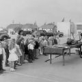 School children line up to watch a fire fighter demonstrate equipment during Fire Prevention week, Burbank, ca. 1950s