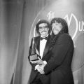 Lionel Richie (left) shakes hands with Rick James while holding an award during the American Music Awards at the Shrine Auditorium in Los Angeles. Richie won the award that year for Favorite Male Artist – Soul/R&B. Guy Crowder Collection