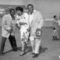 Bandleader and musician Louis Jordan (left), unidentified woman, and photographer Harry Adams (right) at the Cavalcade of Jazz. From Harry Adams Collection. 