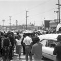 People gathered around the hearse outside Mosque No. 27 during the funeral service for Ronald Stokes, Harry Adams Photograph Collection