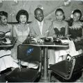 Lorraine Adams (left), Elihu “Black Dot” McGee (center) and his wife Elizabeth (right of McGee), and others at the Tiffany Club. From the Harry Adams Collection. 