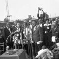 Dr. Martin Luther King, Jr., Sammy Davis, Jr., Wyatt Tee Walker, Reverend Ralph Abernathy, and others stand at a lectern. Freedom Rally, 1963 May 26, Harry Adams Collection, 93.01.HA.B6.N45.954