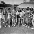 Photographer Charles Williams (fourth from left) stands next to Tina Thomas, winner of the 2nd Annual Queen of the Cavalcade of Jazz (or Sun Crest Queen) beauty contest, and her court, which included Joyce Sonnier, Delores Johnson, Carolyn Matthews, Bobbie Jones, Barbara Bartlett, and Rose-Mary Collins. Cavalcade of Jazz, 1952, Harry Adams Collection, 93.01.HA.N45.B34.152