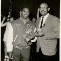 Brad Pye Jr. with young athlete, LA Sentinel, 1967