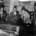 Joe Kawasaki, Watson Burns, Joe Louis, and Braxton Berkley, Sr. at a Los Angeles pool hall, March 2, 1938
