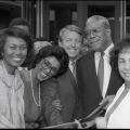 (Left to right) L.A. County Supervisor Yvonne Brathwaite Burke, Museum Director Aurelia Brooks, an unidentified man, Senator Bill Green, and Assemblywoman Teresa P. Hughes pose for a group portrait while holding a pair of giant scissors during the ribbon cutting ceremony for the California African American Museum (CAAM). 1984. Digital ID: 11.06.GC.N35.B2.17.29.07.1