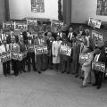 Group photograph of Yvonne Brathwaite Burke in a courtyard of the North Campus, West Angeles Church of God in Christ with a crowd holding signs reading, "Continuing to fight. Yvonne Brathwaite Burke for Supervisor." 1992. Digital ID: 11.06.GC.N35.B5.46.146.27