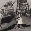 Bettie Ober and Isobel Bork pose with a propeller for the SS John C. Fremont