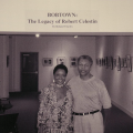 Roland Charles poses with a colleague in front of his exhibit at the Louisiana State Museum. TBC.RCH