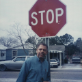 Roland Charles stands next to the stop sign in Bobtown. TBC.RCH