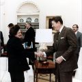 Handshake between antagonists, Helen Thomas and Ronald Reagan