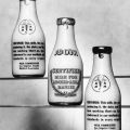 Adohr Farms' milk in bottles labeled "Certified milk for Adohr-able babies," with guarantee on the back, ca. 1936