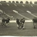 Scrapbook page photograph of Occidental College football players in action, ca. 1920s