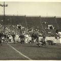 Photograph of Occidental College football players in action, taken by Carroll Photo Service, ca. 1920s