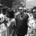 Assemblywoman Maxine Waters speaks into a microphone at the Third Annual Western Regional Black Family Reunion in Los Angeles at Exposition Park. Actor and National Honorary Chairperson, Malcolm-Jamal Warner (left), Brotherhood Crusade President, Danny Bakewell (2nd from right) and civil rights leader and event founder, Dorothy Height look on. 1989. Digital ID: 11.06.GC.N35.B22.11.69.19A