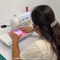 A student using a sewing machine at the Creative Maker Studio at CSUN's University Library