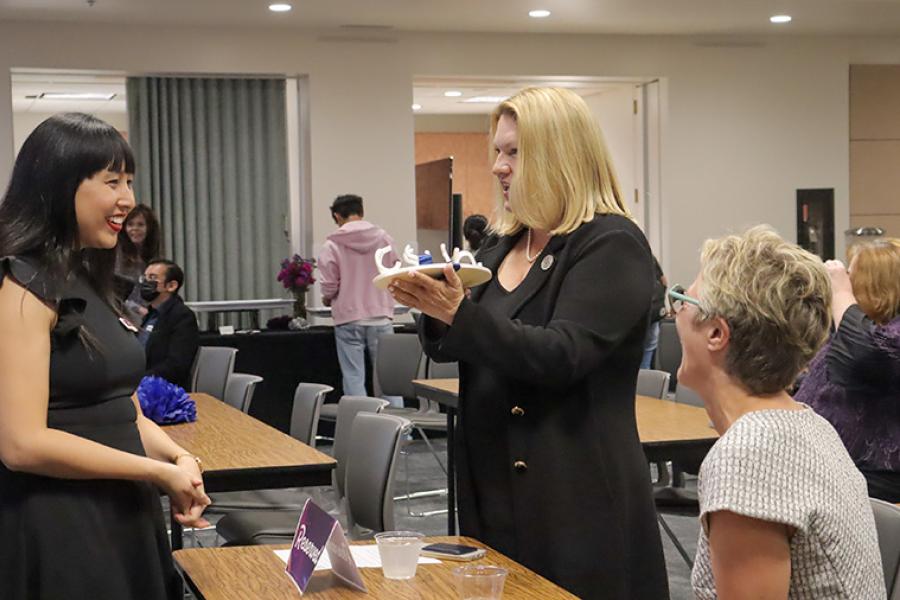 Eva Cohen speaking to President Beck