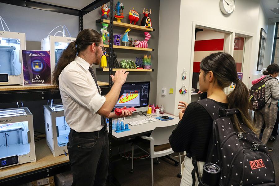 CMS student employee talking to a CSUN student about 3D printing