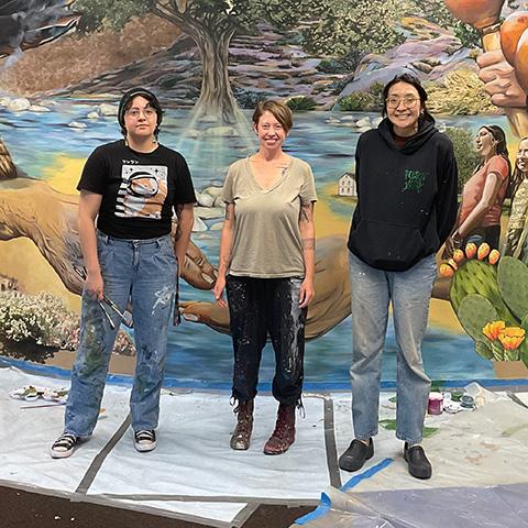 Lindsay Carron and Art students in front of the Tatavium mural