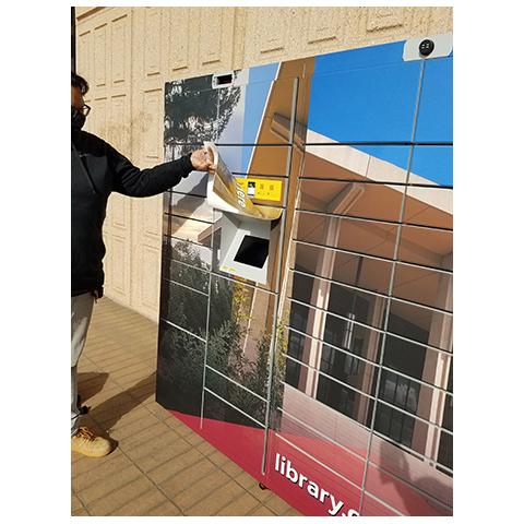 student using locker pick up service at the csun university library