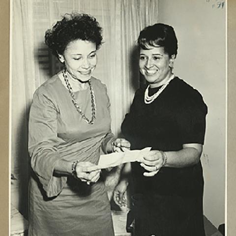 Photograph, Two former Angel City Chapter Presidents presenting scholarship check for "Dollars for Scholars," circa 1967-1968 (Links, Inc., Angel City Chapter Collection)