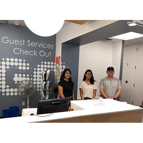 Student workers at the Guest Services desk at CSUN's University Library