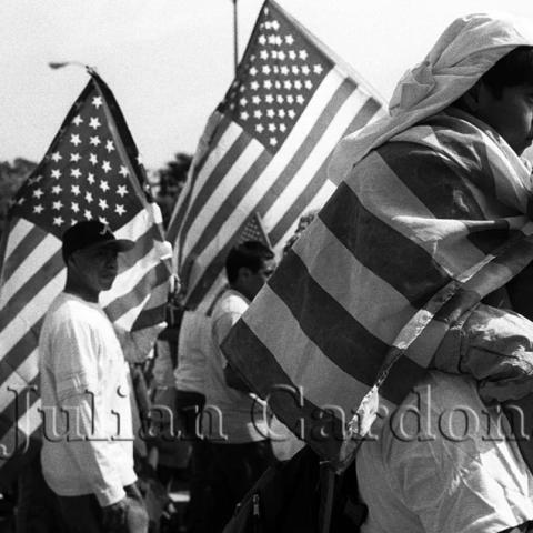 Men holding the American flags during protests.