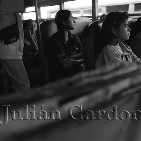 Women seated in a bus.